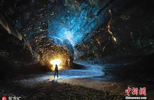 Solid shoot hole of blue ice of glacier of Iceland