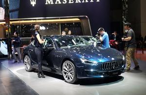 Martha pulls the base of a fruit to exhibit stage 