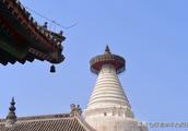 Beijing city has an old white tower, there is towe
