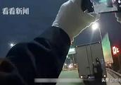 The policeman calls truck driver to get off wipe up plate is accident however fish...