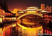 Person wave uses area of situation of city of Hangzhou the Song Dynasty by day, night lights brightl